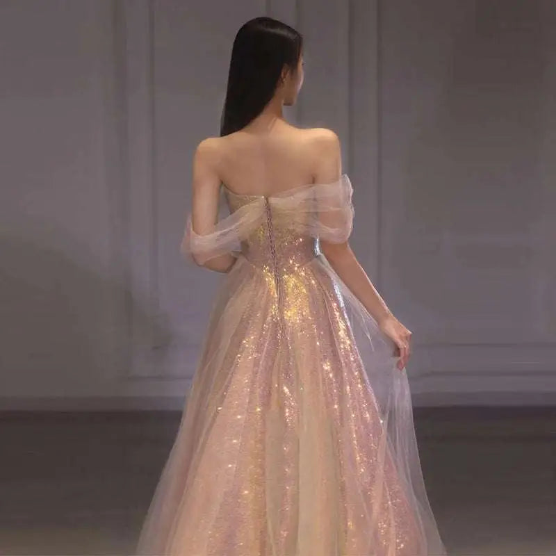 A blush pink gradient mesh slimming annual party banquet mermaid dress with sequined bodice and sheer tulle skirt