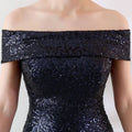 A shimmering black sequined off-the-shoulder slimming host gown perfect as a gradient sequined birthday party dress