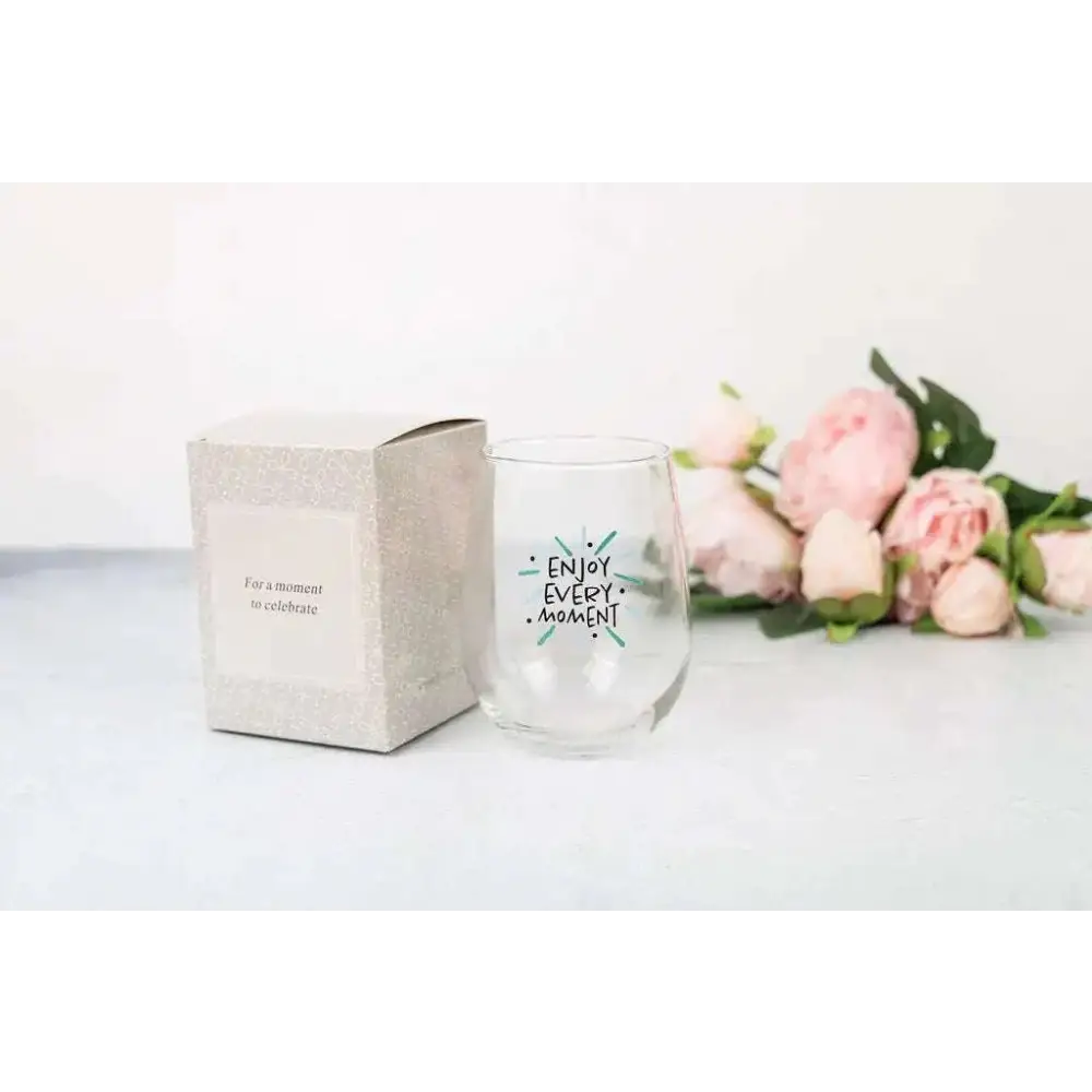Clear stemless wine glass with enjoy every moment printed in black and teal in grapefruit body scrub wine glass spa gift basket