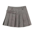 Gray pleated skirt with textured fabric and belt loop detail paired with a double breasted blended coat width design