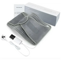 Gray electric heating pad belt with orange panel featuring gray fabric waist belt and white power unit with cord