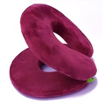 Maroon plush foldable travel pillow with soft velvety texture and circular design, ideal for comfortable travel