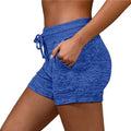 Blue heathered women shorts with drawstring waistband and side pockets made of stretch sports fabric for athletic use