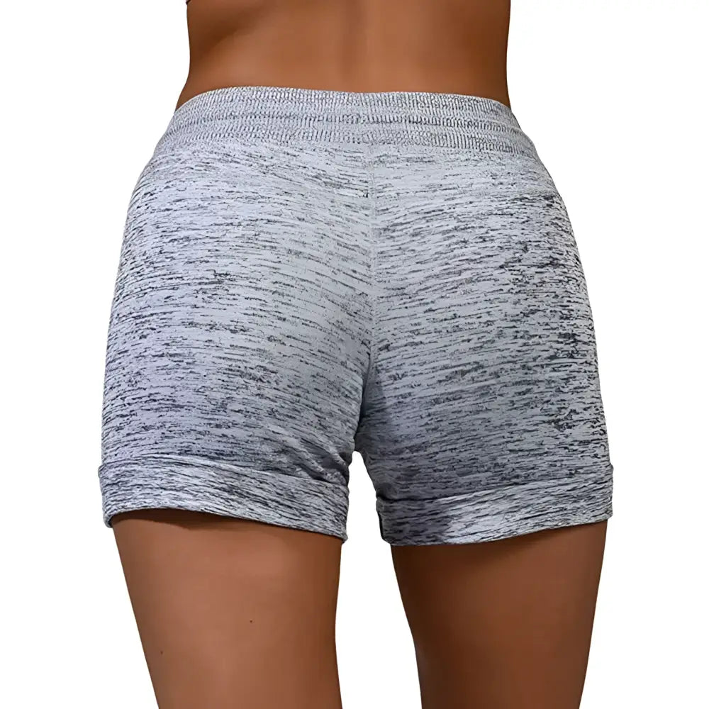 Gray heathered women shorts with drawstring waistband and side pockets made from stretch sports fabric