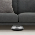 Gray intelligent automatic sweeping machine mini robot vacuum cleaner with sleek silver and black rounded design