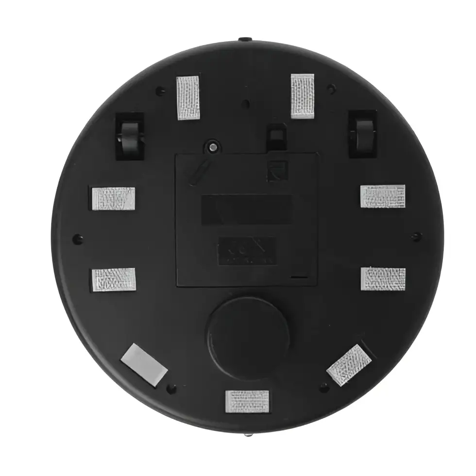 Gray intelligent automatic sweeping machine mini robot black circular base with eight silver adhesive strips and battery compartment