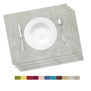 Gray linen placemat set featuring a premium woven texture stacked under a white bowl and silverware for dining table use