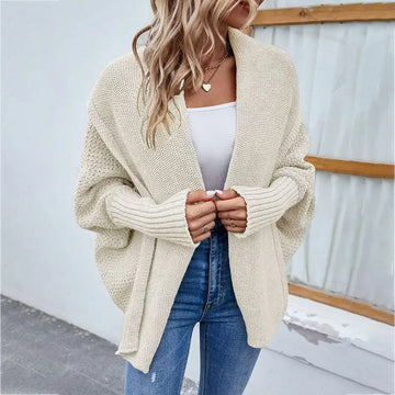 Cream-colored loose knitted sweater with ribbed cuffs and textured weave solid color cardigan
