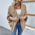 Beige loose knitted sweater with ribbed cuffs and textured open-front design solid color cardigan