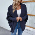 Navy blue loose knitted sweater solid color cardigan with ribbed cuffs and a loose open front design