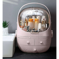Pink rounded makeup organizer with waterproof dust proof transparent dome lid and multiple drawers for cosmetics storage