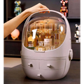 A sleek light gray plastic makeup organizer with waterproof dust proof transparent dome lid and two front drawers