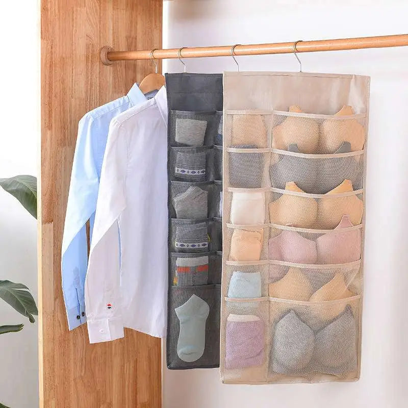 Gray mesh bra hanging storage bag with multiple compartments hanging on a rod for organized lingerie storage