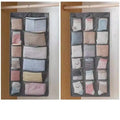 Gray mesh bra hanging storage bag with multiple compartments holding pastel socks in gray fabric organizer
