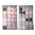 Gray mesh bra hanging storage bag with multiple compartments holding folded bras and underwear for organization
