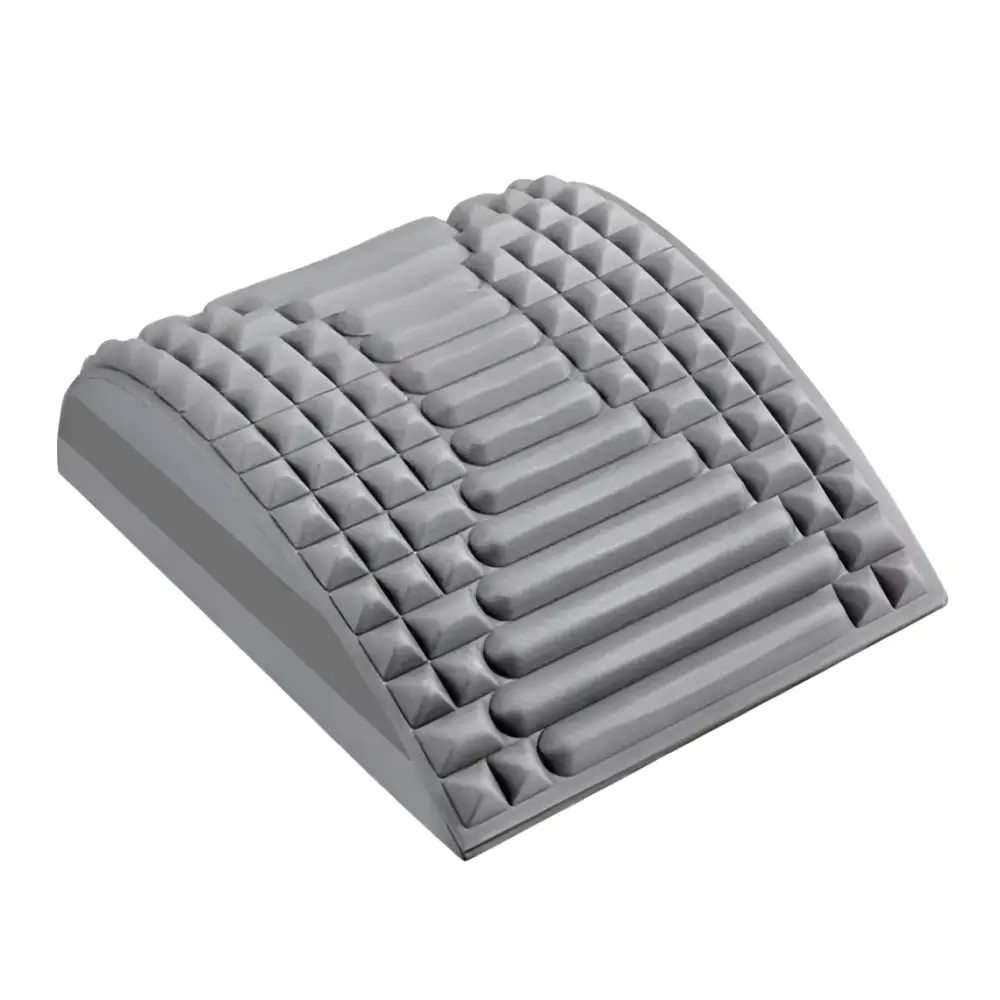 Gray neck and back stretcher cushion with textured raised pyramid and rectangular bumps to alleviate discomfort and relieve tension