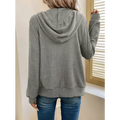 A cozy gray ribbed knit solid color hooded zipper hoodie with long sleeves and relaxed fit
