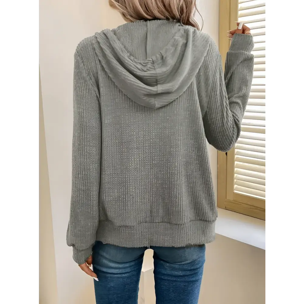 A cozy gray ribbed knit solid color hooded zipper hoodie with long sleeves and relaxed fit