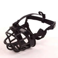 Black plastic dog muzzle with adjustable straps and secure buckle for vet visits as a gray silicone dog muzzle alternative