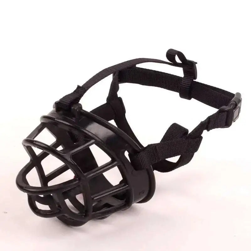 Black plastic dog muzzle with adjustable straps and secure buckle for vet visits as a gray silicone dog muzzle alternative