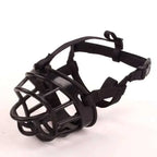 Black plastic dog muzzle with adjustable straps and secure buckle shown from the back for gray silicone dog vet visits