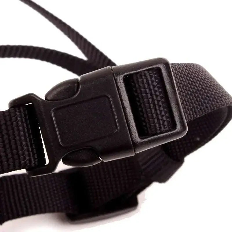Black nylon strap with durable plastic buckle on the back side of gray silicone dog muzzle for vet visits safety