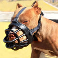 Black plastic dog muzzle with adjustable straps shown from the back for gray silicone dog vet visits and safety