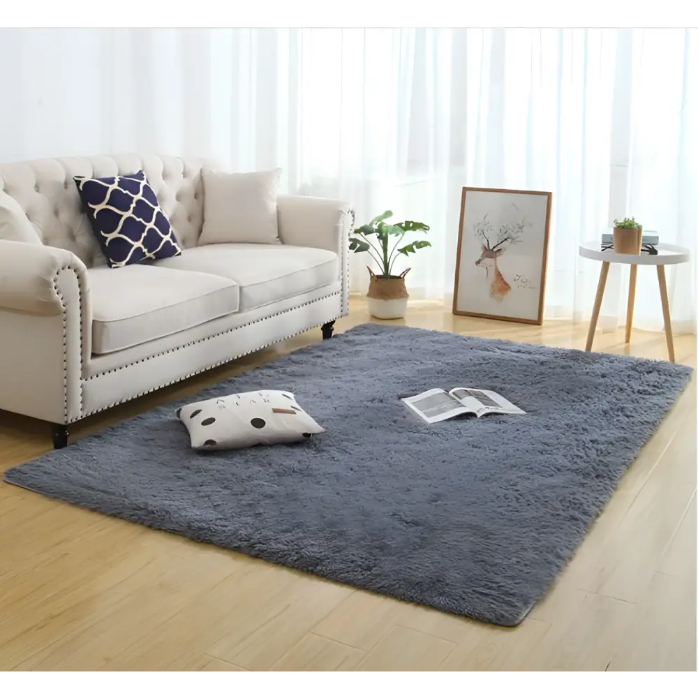 A gray silky fluffy carpet modern home decor shaggy rug with soft plush texture on wooden floor