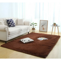 A plush rich brown silky fluffy carpet modern home decor shaggy rug with a soft rectangular texture