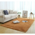 A plush warm orange shaggy area rug with a soft fluffy texture ideal for carpet modern home decor settings