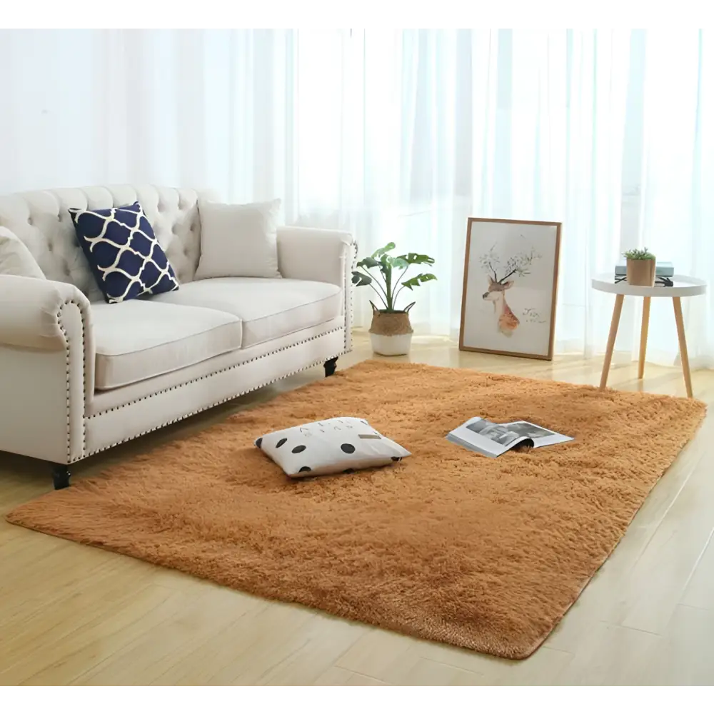 A plush warm orange shaggy area rug with a soft fluffy texture ideal for carpet modern home decor settings