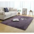 A plush deep purple silky fluffy carpet modern home decor shaggy rug with soft texture and slightly frayed edges