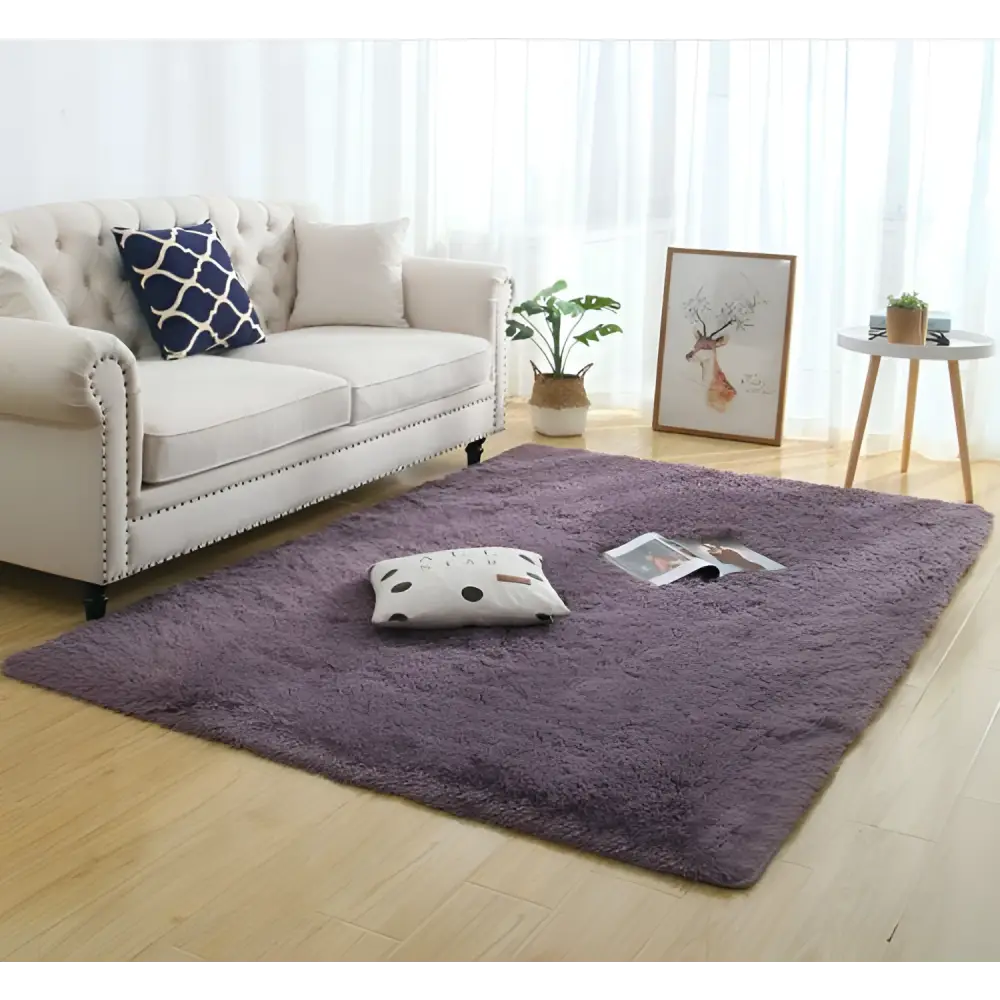 A plush deep purple silky fluffy carpet modern home decor shaggy rug with soft texture and slightly frayed edges