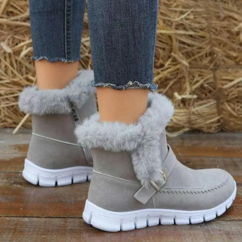 Gray suede snow boots winter with fluffy gray faux fur trim and white rubber sole for cold weather warmth