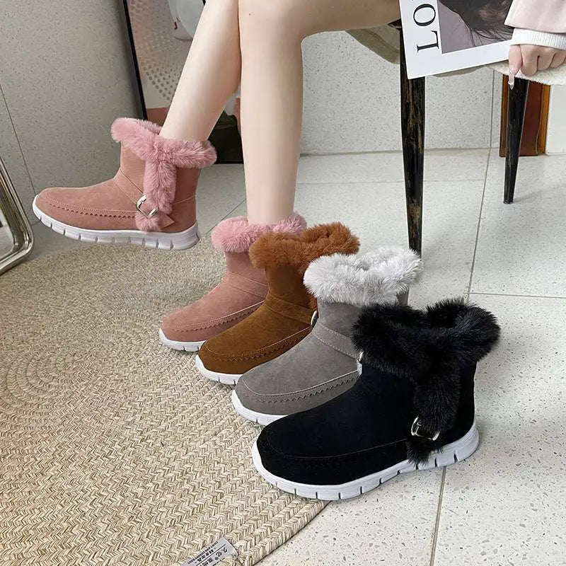 Pink suede snow boots winter warm with fluffy pink faux fur trim and silver buckle detail for cold weather use