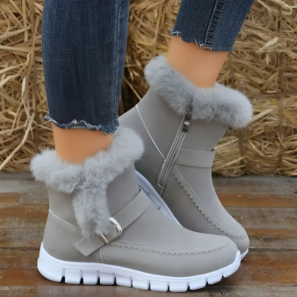Gray suede snow boots winter with fluffy gray faux fur trim and white rubber sole for warmth and style