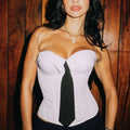 White corset with black tie detail showcasing design ins fashion style and gray suede y2k bandeau influence