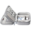 Gray textured fabric digital storage bag travel organizer with mesh compartments and zippered closure for electronics