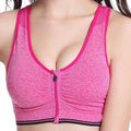 Pink heathered sports bra with bright pink trim and front zipper closure featuring gray textured fabric design