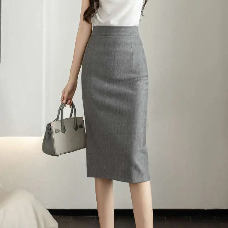 A sleek gray textured line sheath skirt with a high waistband and subtle weave for an elegant tight fit