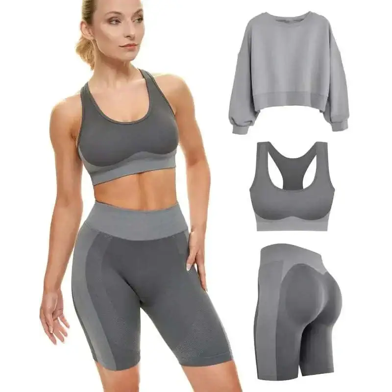 Gray two piece mesh matching workout set with cropped sweatshirt sports bra and high waisted shorts for high impact use