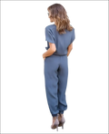 A sleek slate-gray v-neck jumpsuit with short sleeves and tapered pants in a v-neck jumpsuit image