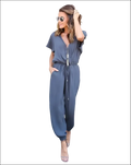 A stylish gray v-neck jumpsuit with short sleeves and a drawstring waist in a v-neck jumpsuit image