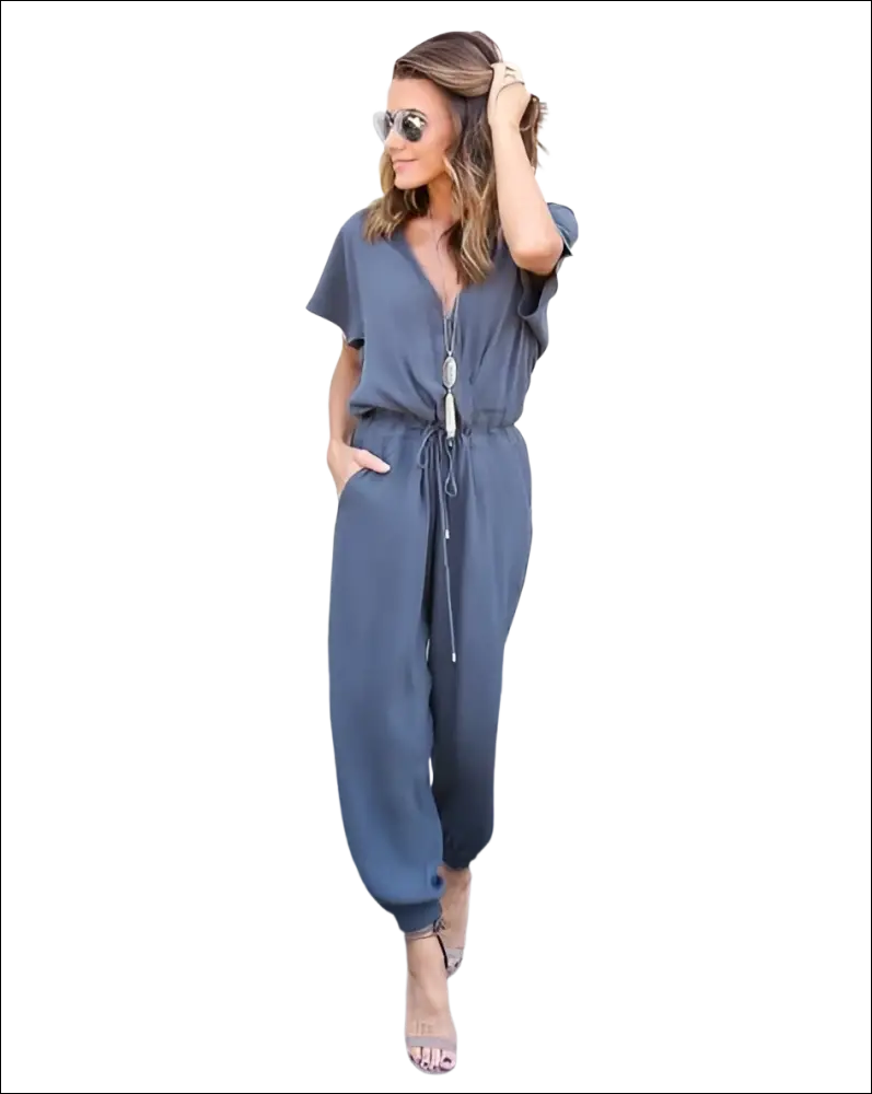 A stylish gray v-neck jumpsuit with short sleeves and a drawstring waist in a v-neck jumpsuit image