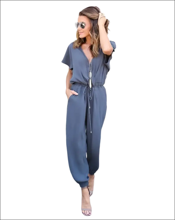 A stylish gray v-neck jumpsuit with short sleeves and a drawstring waist in a v-neck jumpsuit image
