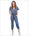 A stylish navy blue v-neck jumpsuit with short sleeves and a drawstring waist in a jumpsuit image