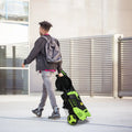 Green and black high pressure cleaner with coiled hose and wheels for efficient cleaning and easy mobility