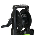 Black plastic garden hose reel with textured handle and crank on green and black high pressure cleaner with coiled hose