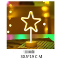 A glowing neon star-shaped led neon light with warm yellow light on a wooden base creating perfect ambiance