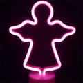 Pink neon angel-shaped led neon lights creating perfect ambiance for green christmas tree decoration with base